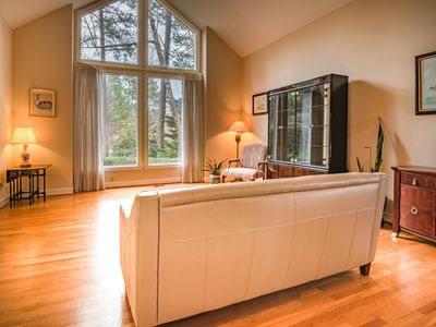 Bright and airy training room with wooden floors.
